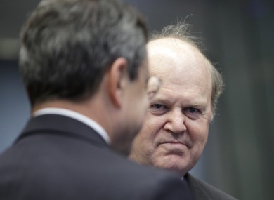 Michael Noonan speaks with Mario Draghi at a meeting in Luxembourg last month