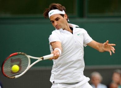 Federer in action against Mikhail Youzhny.