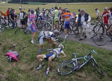 Rob Ruijgh tends to his injured teammate Wouter Poels after today's crash.