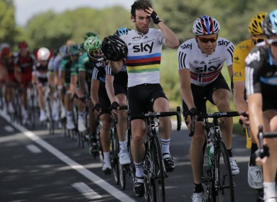 Mark Cavendish of Britain adjusts his helmet as he rides in the pack during the 10th stage.