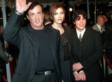 A 1996 file photo of Sylvester Stallone, left, with his girlfriend Jennifer Flavin, center, and his son Sage Stallone