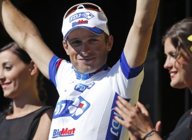 Stage winner Pierrick Fedrigo of France celebrates on the podium of the 15th stage of the Tour de France.