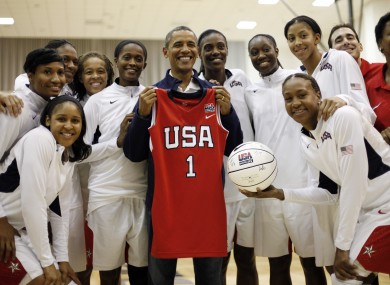 Obama posing with the Team USA women's players.