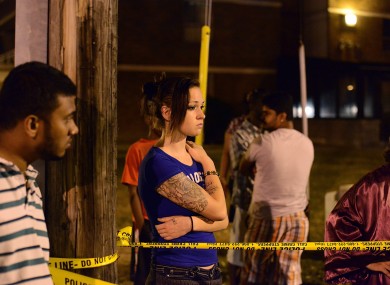 Pedestrians near the scene of the shooting on Monday night.