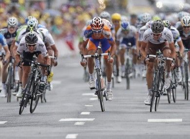Cavendish, left, sprints past Luis-Leon Sanchez yesterday.