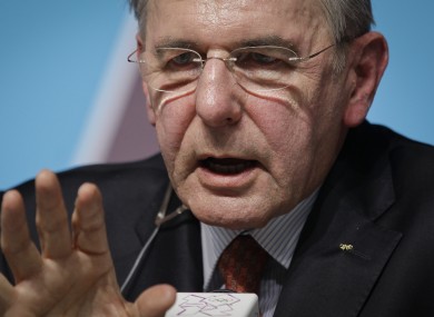 International Olympic Committee (IOC) President Jacques Rogge gestures to a reporter at a press conference for the media at the 2012 Summer Olympics.