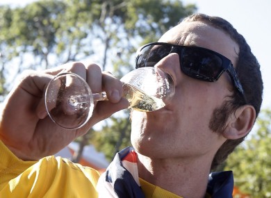 Bradley Wiggins, winner of the 2012 Tour de France cycling race, enjoys a glass of champagne.