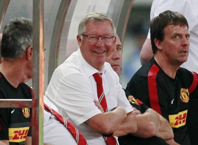 anchester United boss Alex Ferguson smiles after Shinji Kagawa scores against Shanghai Shenhua yesterday.