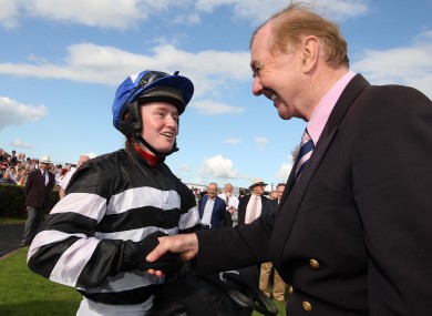 History-maker Jane Mangan is congratulated by the King of Ballybrit, Dermot Weld, after her win in the Carlton Hotel Galway City (Q.R.) Handicap yesterday.