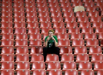 A supporter watches on during Ireland's uninspiring 0-0 draw with Serbia this evening.