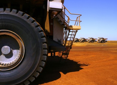 In this photo taken on March 4, 2010, large dump trucks are lined up at Rio Tinto operations at Dampier in Western Australia.