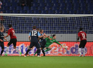 St Pat's goalkeeper Brendan Clarke is beaten by Hannover's Karim Haggui (3) for the opening goal.