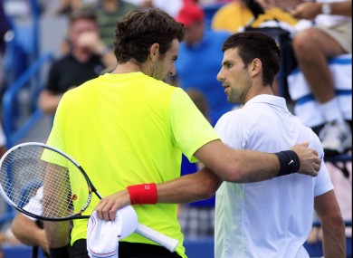 Del Potro and Djokovic chat at the net following the Serbian's win.