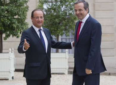 Francois Hollande (left) welcomes Antonis Samaras to Paris.