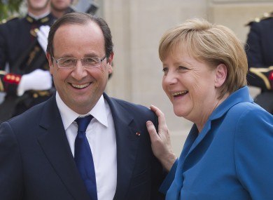 File photo of Francois Hollande and Angela Merkel