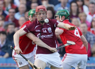 Galway's Joe Canning is tackled by Eoin Cadogan and Brian Murphy of Cork.