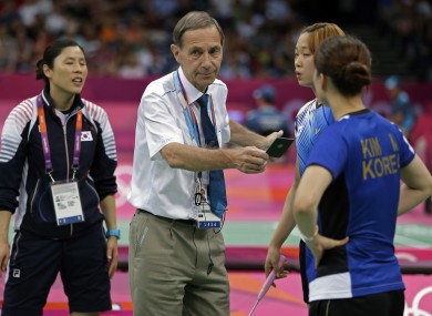 Head badminton referee Torsten Berg issues the black cards last night.