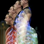 This multiple exposure photo shows Belarus' Aliaksandr Makaranka competing during the men's 94-kg, group B, weightlifting competition at the 2012 Summer Olympics. (AP Photo/Patrick Semansky)