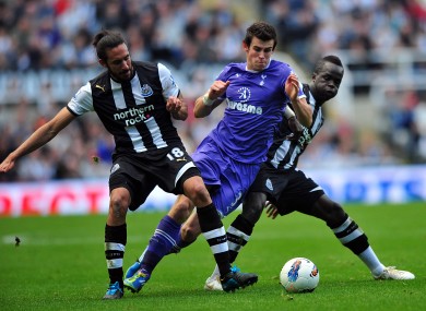 Newcastle's Jonas Gutierrez and Cheick Tiote challenge Gareth Bale of Spurs.