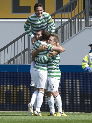 Kris Commons celebrates with his Celtic teammates.