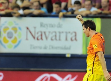 F.C. Barcelona's Lionel Messi from Argentina, celebrates after scoring against Osasuna.
