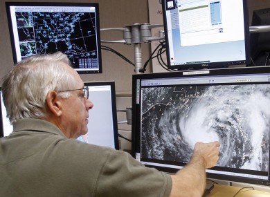 Senior hurricane specialist Stacy Stewart tracks Tropical Storm Isaac at the National Hurricane Center in Miami