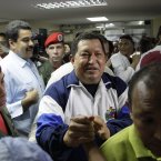 President Hugo Chavez greets supporters during a visit to injured people at the Rafael Calle Sierra's public hospital in Punto Fijo on Monday after the refinery explosion. (AP Photo/Ariana Cubillos/PA)