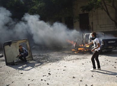 Egyptian protesters throw stones during clashes near the U.S. embassy in Cairo, Egypt.
