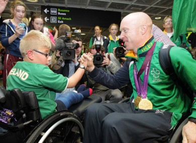 Gold medallist Mark Rohan at the homecoming for Irish athletes on Monday with 9-year-old Shane Barker