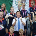 Prime Minister David Cameron and Team GB athletes watch Great Britain swimmer Ellie Simmonds win a gold medal in the Women's 200m at the Aquatic Centre in the Paralympic Games in London.  PRESS ASSOCIATION Photo. Picture date: Monday September 3 2012 See PA story. Photo credit: Stefan Rousseau/PA