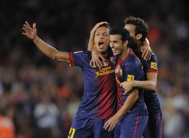 FC Barcelona's Adriano, left, reacts after scoring against Valencia during a Spanish La Liga match.