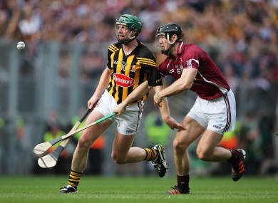 Henry Shefflin and Tony Og Regan battle for possession in the drawn final.