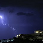 Lightening illuminates the ancient Parthenon temple atop the Acropolis hill in Athens. (AP Photo/Dimitri Messinis)