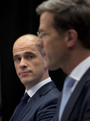 Liberal premier Mark Rutte, right, and Labour's Diederik Samsom attend a joint news conference in The Hague.
