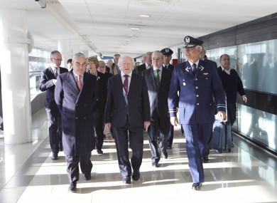 President Higgins arriving to Santiago Arturo Merino Benitez Airport with Ambassador James Sinclair Manley (left) and Brigadier General Ronaldo Mercado , General Commander of the Air Garrison yesterday morning.