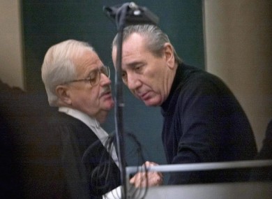 Vito Rizzuto, right, reputed head of the Montreal Mafia, speaks with his attorney Jean Salois after his hearing in Montreal on Feb. 6, 2004.