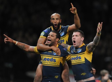 Leeds Rhinos' Ryan Bailey (left), Brett Delaney and Jamie Jones-Buchanan (top) celebrate.
