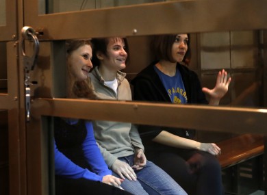 The band members sit in a glass cage at a court room in Moscow, Russia on Monday 1 Oct, 2012