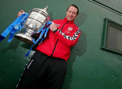 Molloy holds the trophy.
