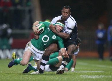 Fergus McFadden is tackled by Vereniki Goneva of Fiji.