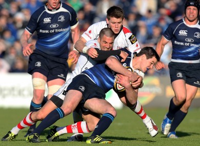 Ian Humphreys and Craig Gilroy combine to tackle Jonny Sexton in 2011.