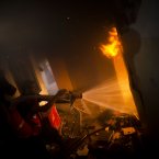 Palestinians firefighters try to extinguish a fire after an Israeli strike on a building of Gaza City.
(AP Photo/Bernat Armangue)