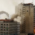 Smoke and fire are seen from an explosion by a high rise housing media organizations in Gaza City.
(AP Photo/Hatem Moussa)