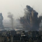 Smoke rises following an Israeli attack on smuggling tunnels on the border between Egypt and Rafah, southern Gaza Strip.
(AP Photo/Eyad Baba)