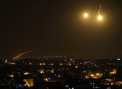 An Israeli illumination round is seen along the Israel and Gaza borders as it lights the sky east of Gaza City