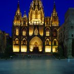 SPAIN Catalonia Barcelona The Cathedral.  Exterior facade and entrance illuminated at dusk.