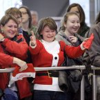 Bernadette Hynes, centre, sees her son Karl and Imelda O'Reilly sees her daughter Colette pass through the arrivals gate together after traveling home from Adelaide for Christmas today at Dublin Airport. Photo: Mark Stedman/Photocall Ireland