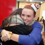 Donna Hayes (25) from Cork is greeted by cousin Caoimhe Dulla after traveling home from Singapore for Christmas today at Dublin Airport. Photo: Mark Stedman/Photocall Ireland