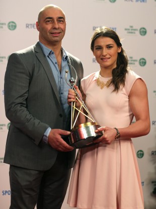 Winning: Katie Taylor, right, with her father and coach Pete.