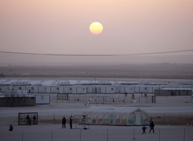 Young Syrian refugees play football at the Zaatari refugee camp in Jordan on Christmas Day.